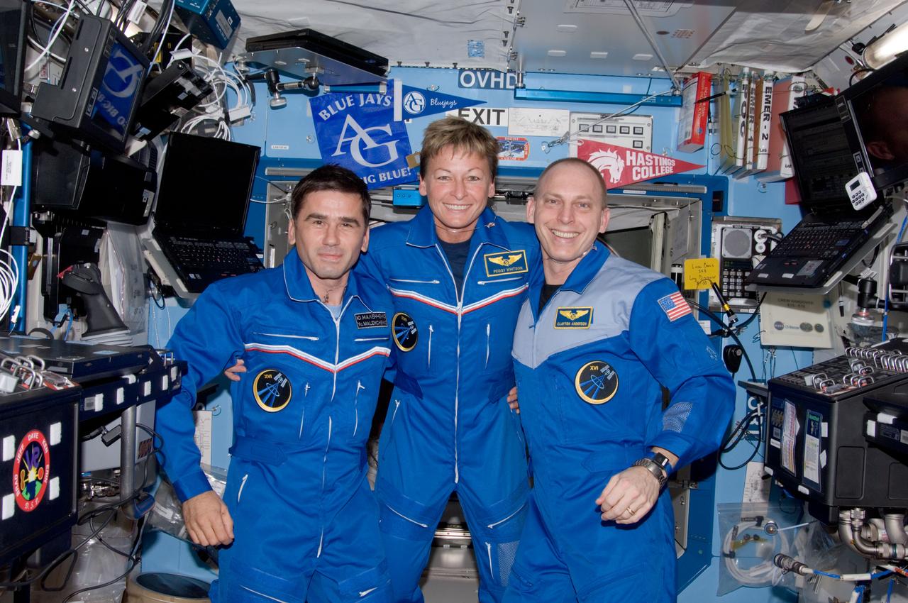 ISS015-E-34609 (16 Oct. 2007) --- NASA astronauts Peggy A. Whitson (center), Expedition 16 commander; Clay Anderson (right), flight engineer; and cosmonaut Yuri I. Malenchenko, flight engineer representing Russia's Federal Space Agency, pose for a photo in the Destiny laboratory of the International Space Station.
