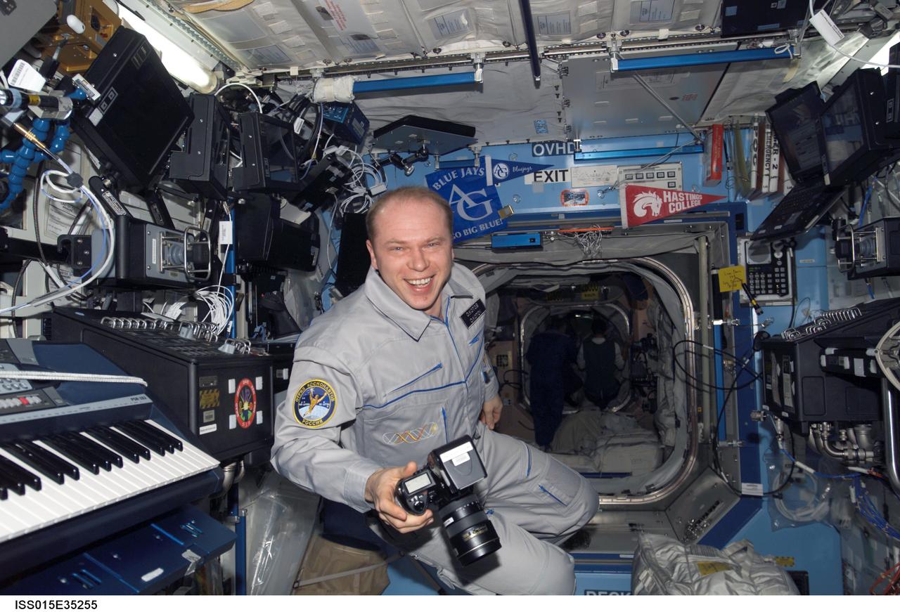 ISS015-E-35255 (12 Oct. 2007) --- Cosmonaut Oleg V. Kotov, Expedition 15 flight engineer representing Russia's Federal Space Agency, holds a still camera in the Destiny laboratory of the International Space Station.