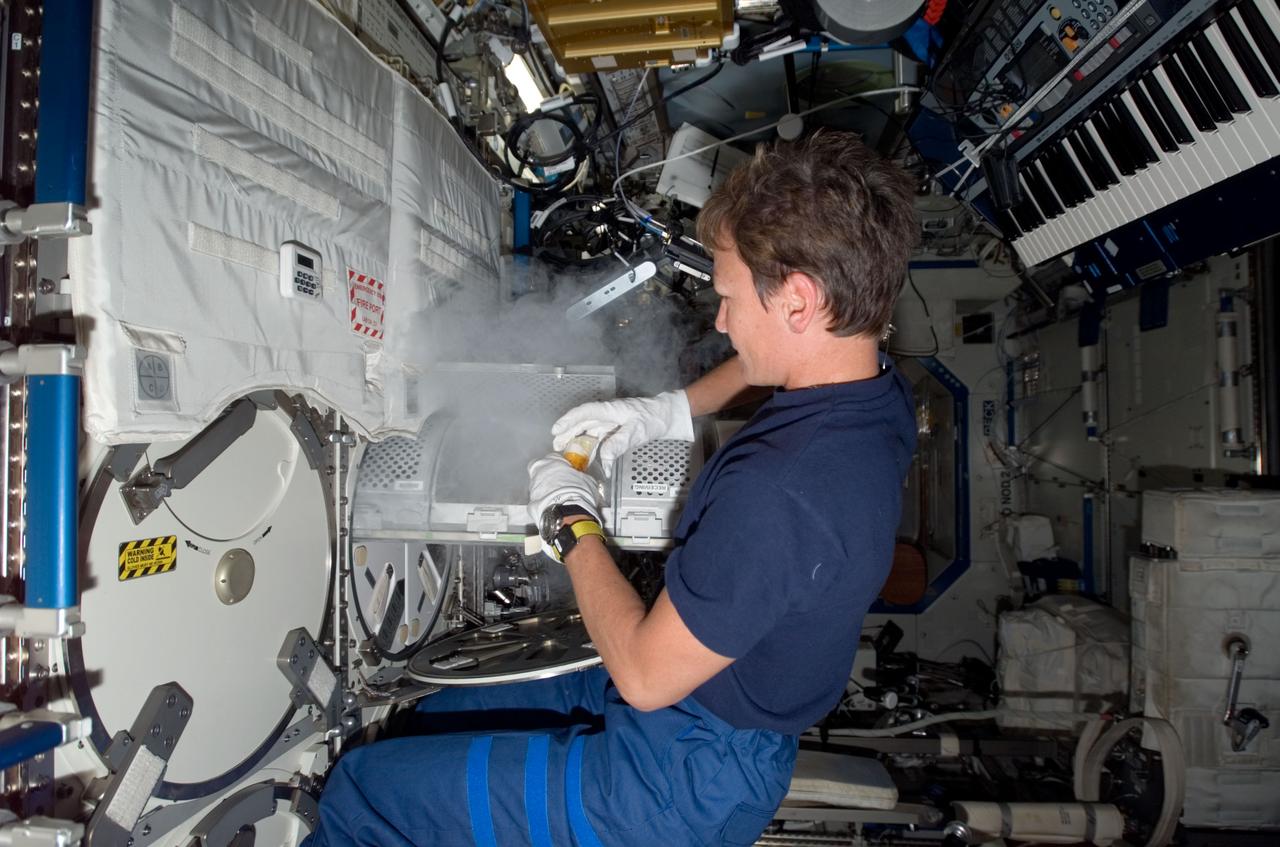 ISS015-E-35308 (19 Oct. 2007) --- NASA astronaut Peggy A. Whitson, Expedition 16 commander, works with the Minus Eighty Degree Laboratory Freezer for ISS (MELFI) in the Destiny laboratory of the International Space Station. MELFI is a low temperature freezer facility with nominal operating temperatures of -80, -26 and +4 degrees Celsius that will preserve experiment materials over long periods.