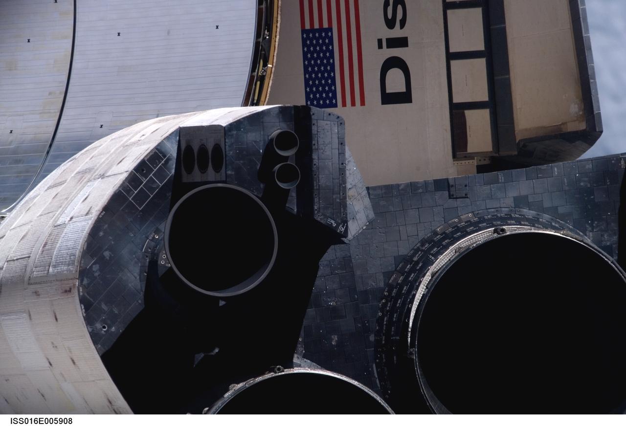 ISS016-E-005908 (25 Oct. 2007) --- A close-up view of Space Shuttle Discovery's tail section is featured in this image photographed by an Expedition 16 crewmember during a backflip maneuver performed by the approaching visitors (STS-120) to the International Space Station. The image provides partial views of the shuttle's main engines, orbital maneuvering system (OMS) pods, a portion of the payload bay door panels and the shuttle's wings.