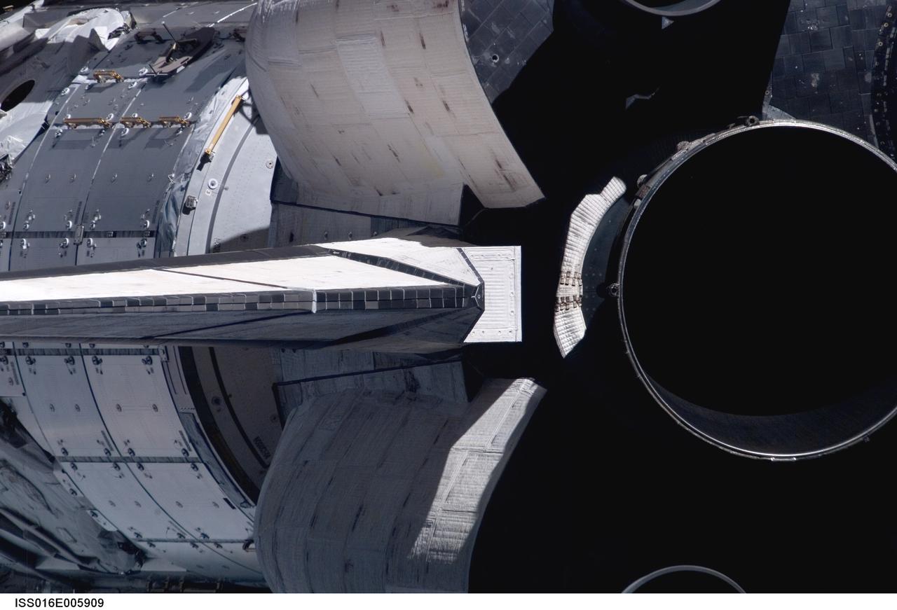 ISS016-E-005909 (25 Oct. 2007) --- A close-up view of Space Shuttle Discovery's tail section is featured in this image photographed by an Expedition 16 crewmember during a backflip maneuver performed by the approaching visitors (STS-120) to the International Space Station. The image provides partial views of the shuttle's main engines, orbital maneuvering system (OMS) pods, vertical stabilizer and the Harmony node in the payload bay.