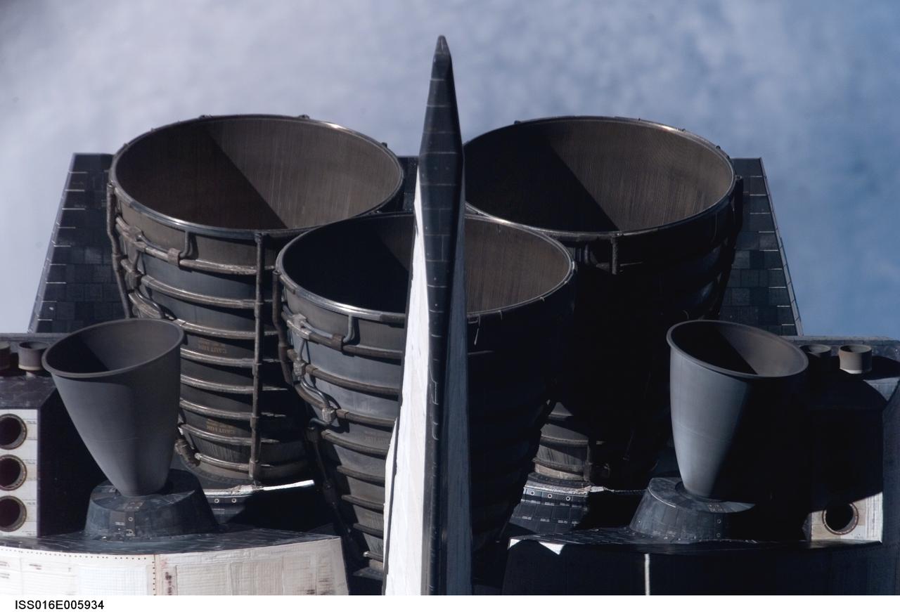 ISS016-E-005934 (25 Oct. 2007) --- The Space Shuttle Discovery's tail section is featured in this image photographed by an Expedition 16 crewmember during a backflip maneuver performed by the approaching visitors (STS-120) to the International Space Station. Visible are the shuttle's main engines and vertical stabilizer.