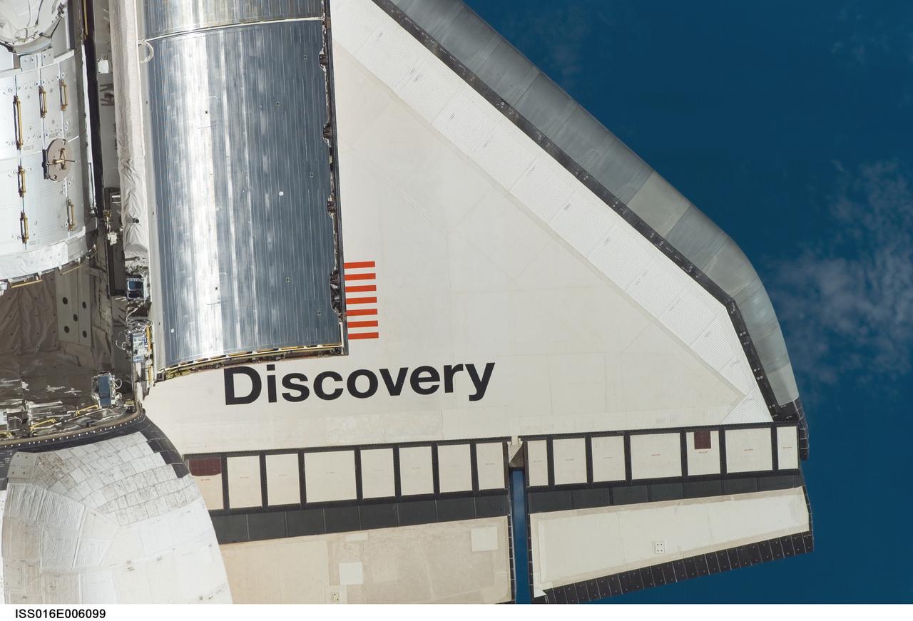 ISS016-E-006099 (25 Oct. 2007) --- Space Shuttle Discovery's starboard wing section is featured in this close-up image photographed by an Expedition 16 crewmember during a backflip maneuver performed by the approaching visitors (STS-120) to the International Space Station. Also visible are partial views of the orbital maneuvering system (OMS) pods and a portion of the Harmony node and payload bay door panels.