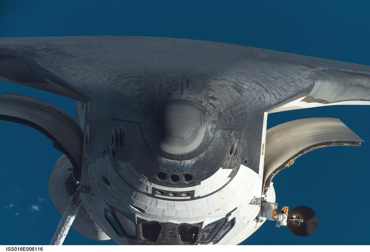 ISS016-E-006116 (25 Oct. 2007) --- The nose and part of the underside of the Space Shuttle Discovery are featured in this close-up image photographed by an Expedition 16 crewmember during a backflip maneuver performed by the approaching visitors (STS-120) to the International Space Station. The Ku-band antenna, instrumental in communications operations, is visible on the port side of the orbiter.