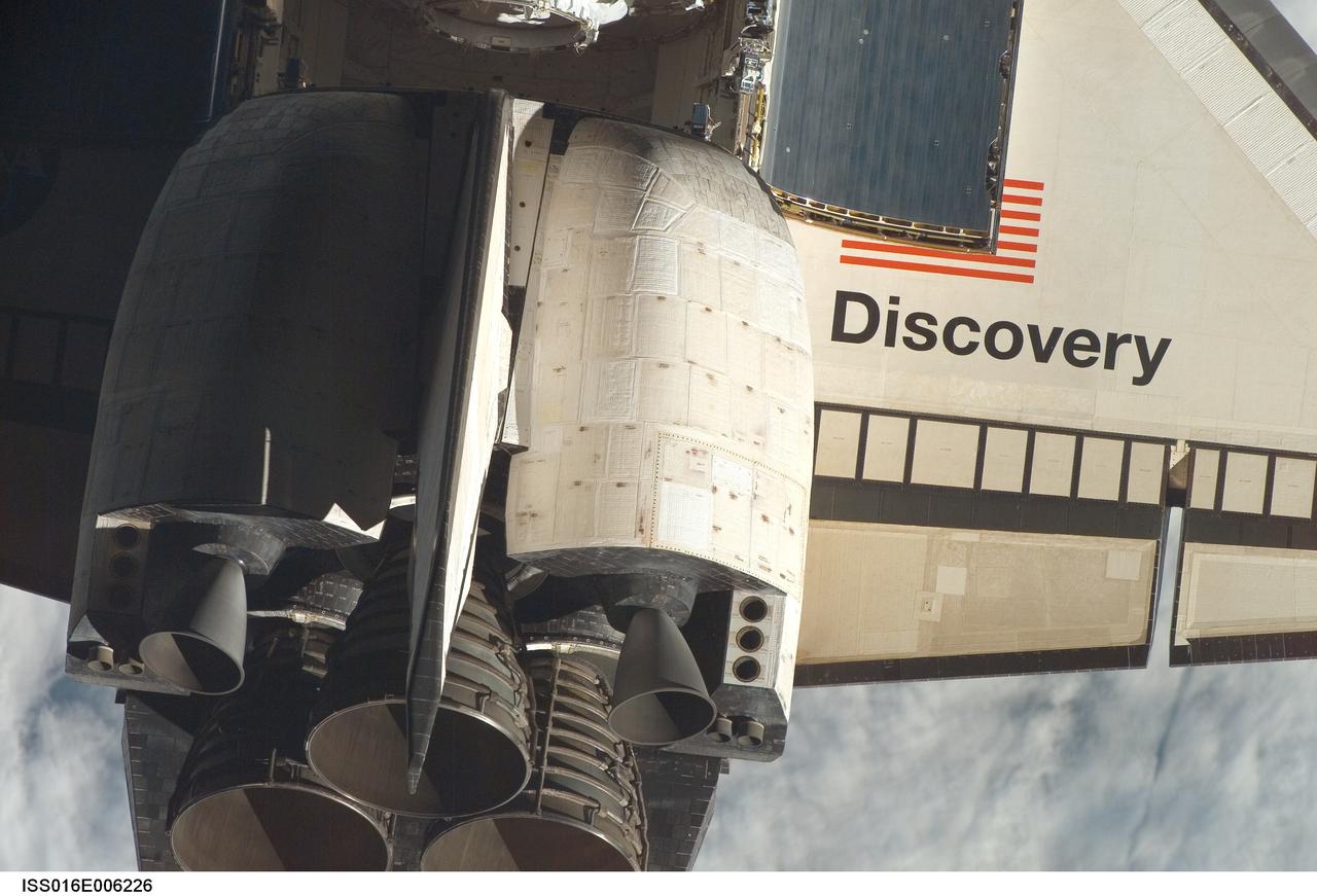 ISS016-E-006226 (25 Oct. 2007) --- Space Shuttle Discovery's tail section is featured in this close-up image photographed by an Expedition 16 crewmember during a backflip maneuver performed by the approaching visitors (STS-120) to the International Space Station. The image provides partial views of the shuttle's main engines, starboard wing section, orbital maneuvering system (OMS) pods, vertical stabilizer and payload bay door panels.