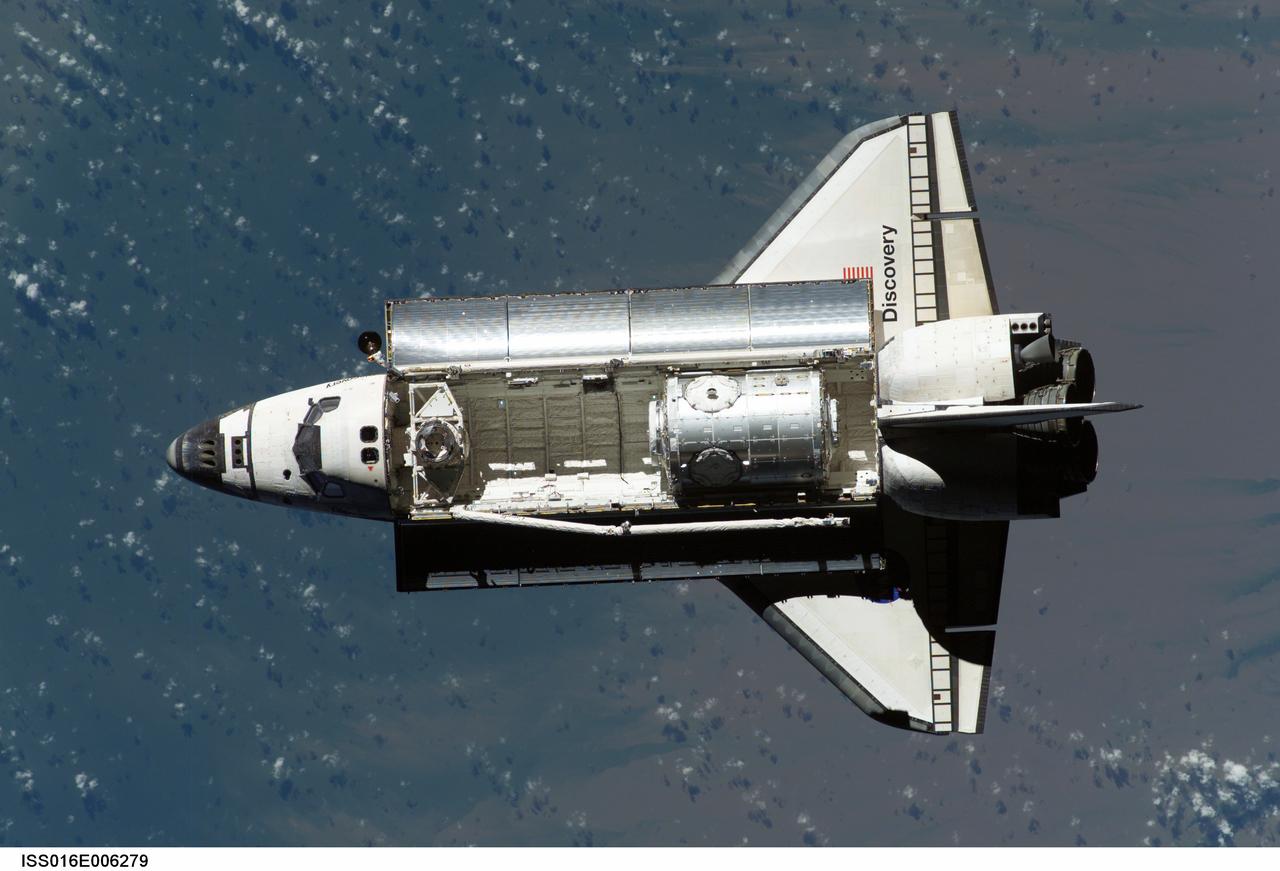 ISS016-E-006279 (25 Oct. 2007) --- Backdropped by a blue and white Earth, Space Shuttle Discovery approaches the International Space Station during STS-120 rendezvous and docking operations. Docking occurred at 7:40 a.m. (CDT) on Oct. 25, 2007. The Harmony node is visible in Discovery's cargo bay.