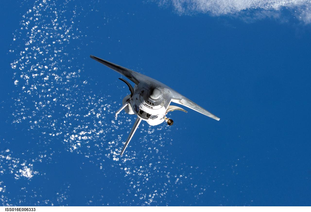 ISS016-E-006333 (25 Oct. 2007) --- Backdropped by a blue and white Earth, Space Shuttle Discovery approaches the International Space Station during STS-120 rendezvous and docking operations. Docking occurred at 7:40 a.m. (CDT) on Oct. 25, 2007. The Harmony node is visible in Discovery's cargo bay.