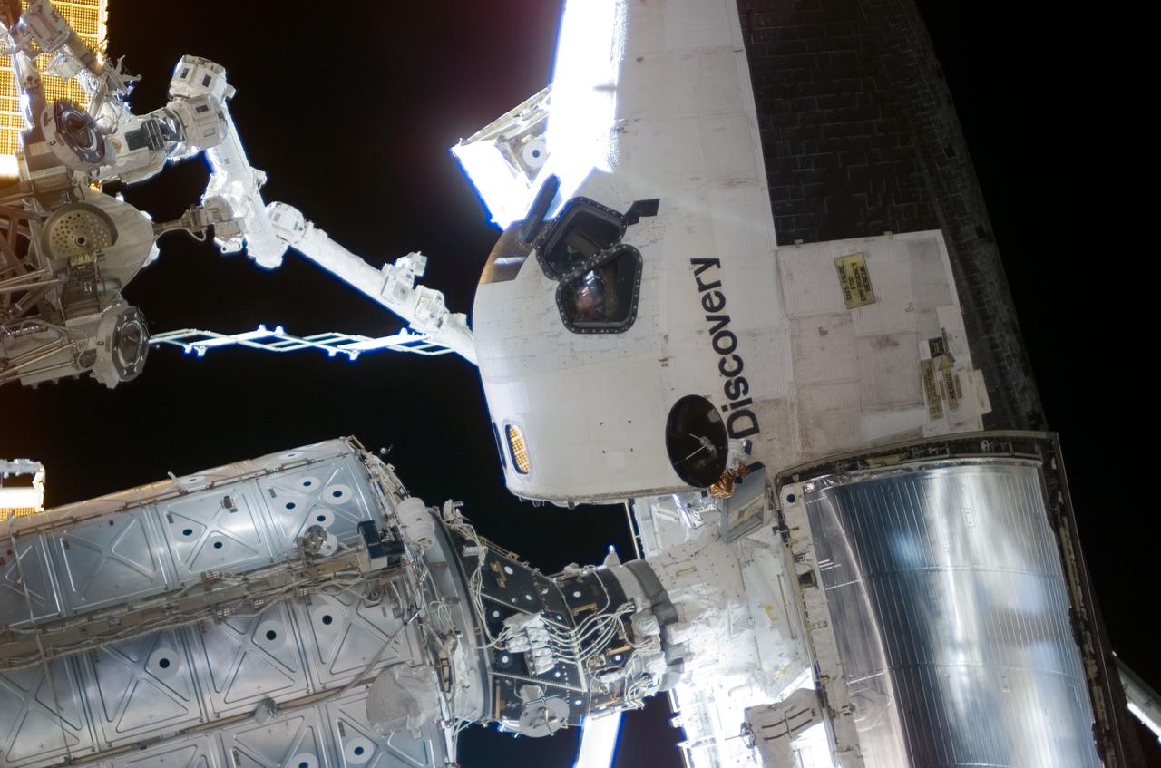 ISS016-E-006573 (28 Oct. 2007) --- Space Shuttle Discovery, docked to the Pressurized Mating Adapter (PMA-2) on the International Space Station, is featured in this image photographed by a spacewalker during the second session of extravehicular activity (EVA) for the STS-120 mission.