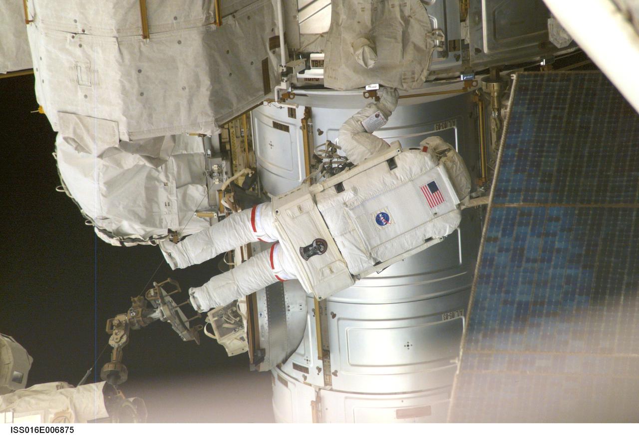 ISS016-E-006875 (26 Oct. 2007) --- Astronaut Scott Parazynski, STS-120 mission specialist, participates in the first of five scheduled sessions of extravehicular activity (EVA) to perform work on the International Space Station while Space Shuttle Discovery is docked to the station. In just over six hours, Parazynski and astronaut Doug Wheelock (out of frame), mission specialist, installed the Harmony module in its temporary location on the station, readied the P6 truss for its relocation during the second EVA session, retrieved a failed radio communications antenna and snapped shut a window cover on Harmony that opened during launch on Discovery.