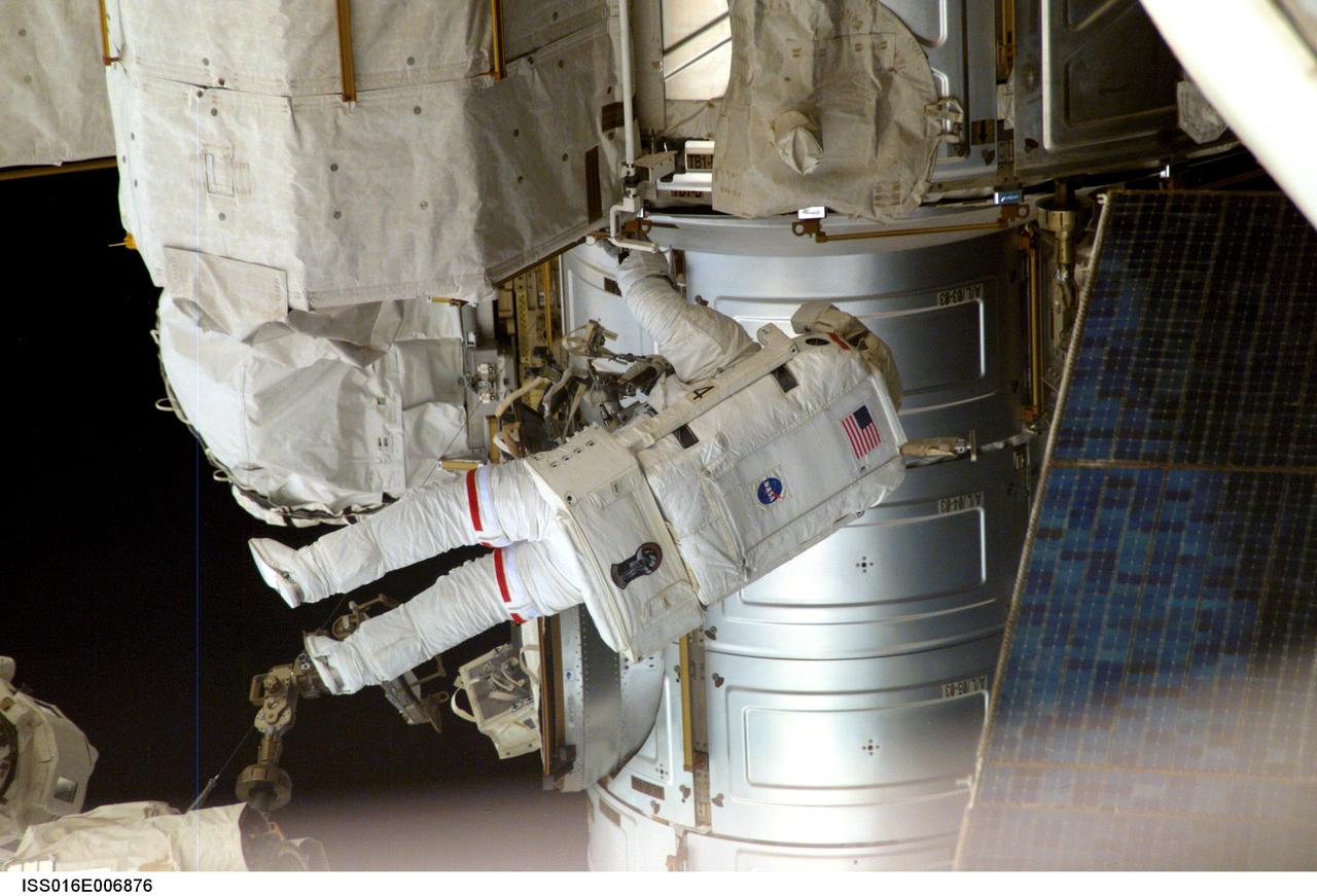 ISS016-E-006876 (26 Oct. 2007) --- Astronaut Scott Parazynski, STS-120 mission specialist, participates in the first of five scheduled sessions of extravehicular activity (EVA) to perform work on the International Space Station while Space Shuttle Discovery is docked to the station. In just over six hours, Parazynski and astronaut Doug Wheelock (out of frame), mission specialist, installed the Harmony module in its temporary location on the station, readied the P6 truss for its relocation during the second EVA session, retrieved a failed radio communications antenna and snapped shut a window cover on Harmony that opened during launch on Discovery.