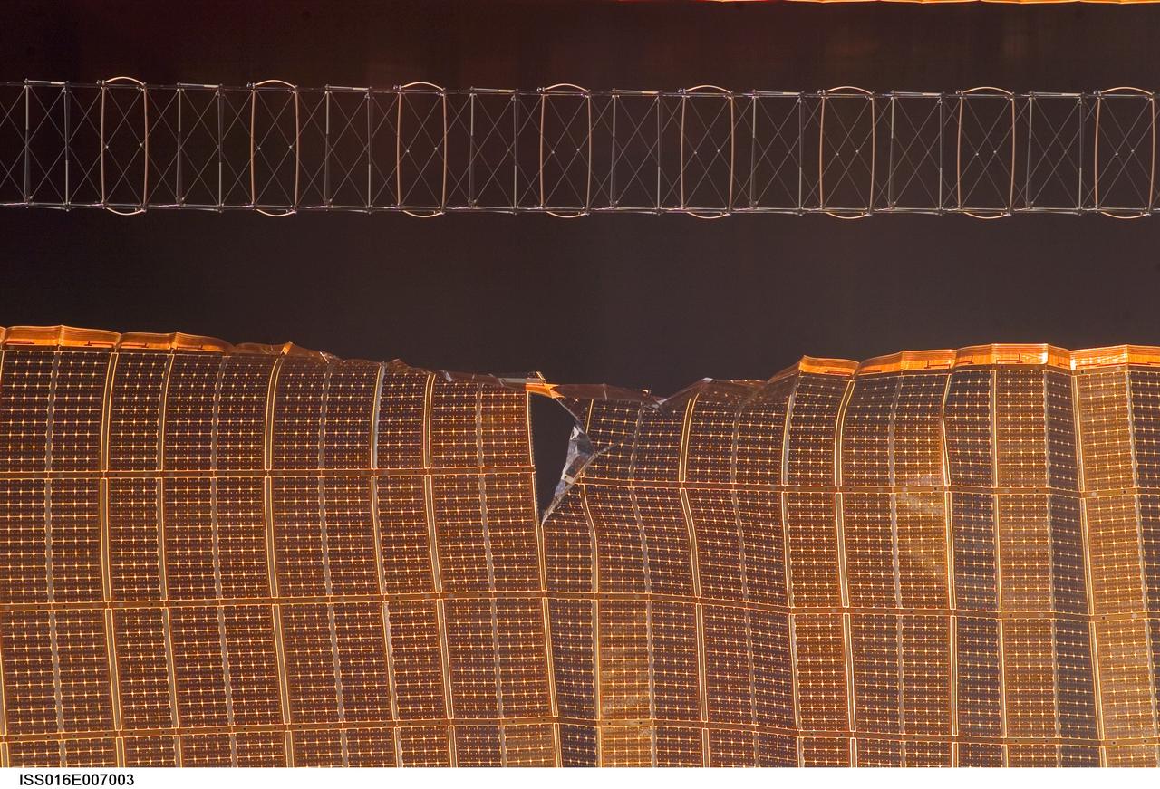 ISS016-E-007003 (30 Oct. 2007) --- A view of a damaged P6 4B solar array wing on the International Space Station. NASA halted the deployment -- which is about 80 percent complete -- to evaluate the damage.