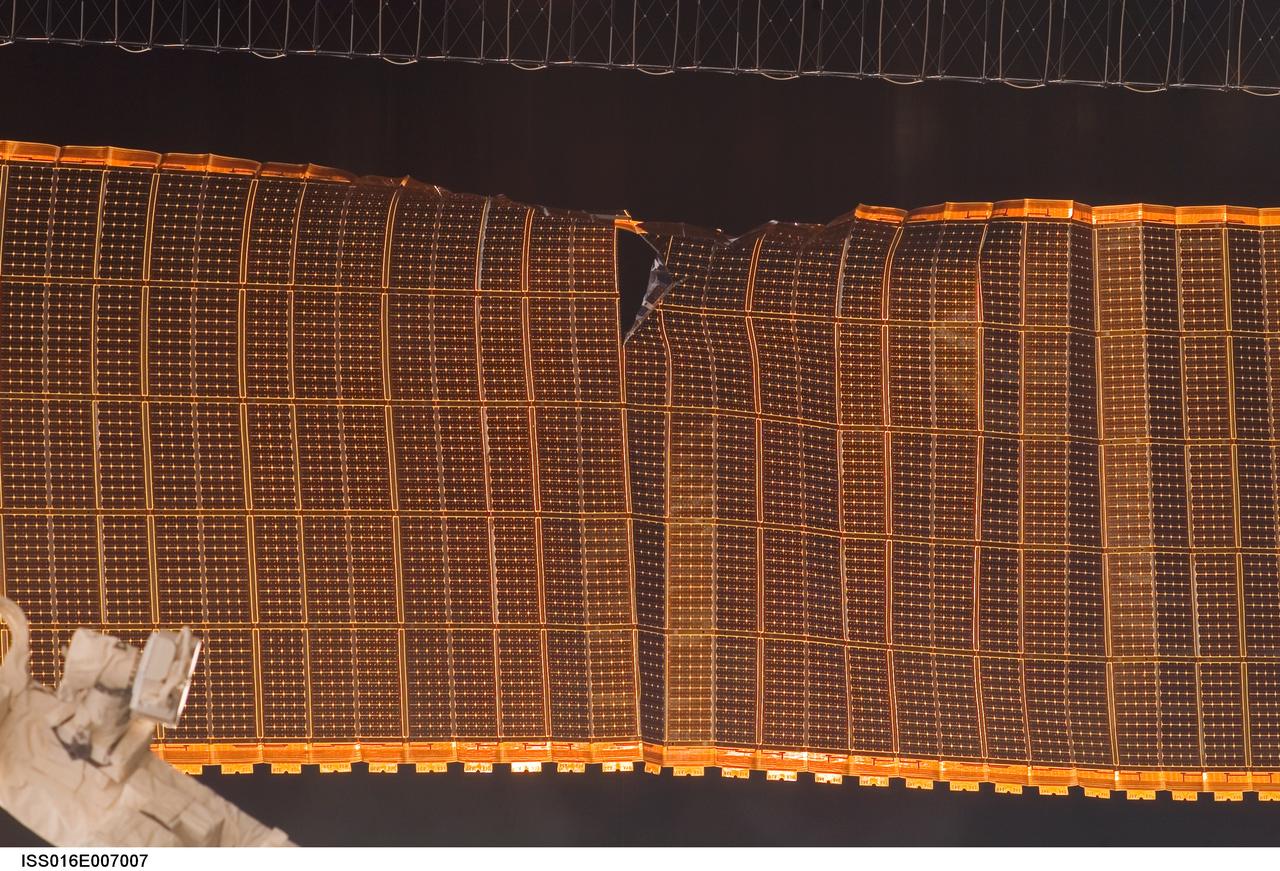 ISS016-E-007007 (30 Oct. 2007) --- A view of a damaged P6 4B solar array wing on the International Space Station. NASA halted the deployment -- which is about 80 percent complete -- to evaluate the damage.