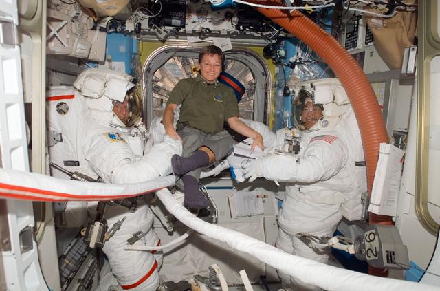 NASA image: Parazynski, Whitson and Tani in the A/L prior to EVA 2