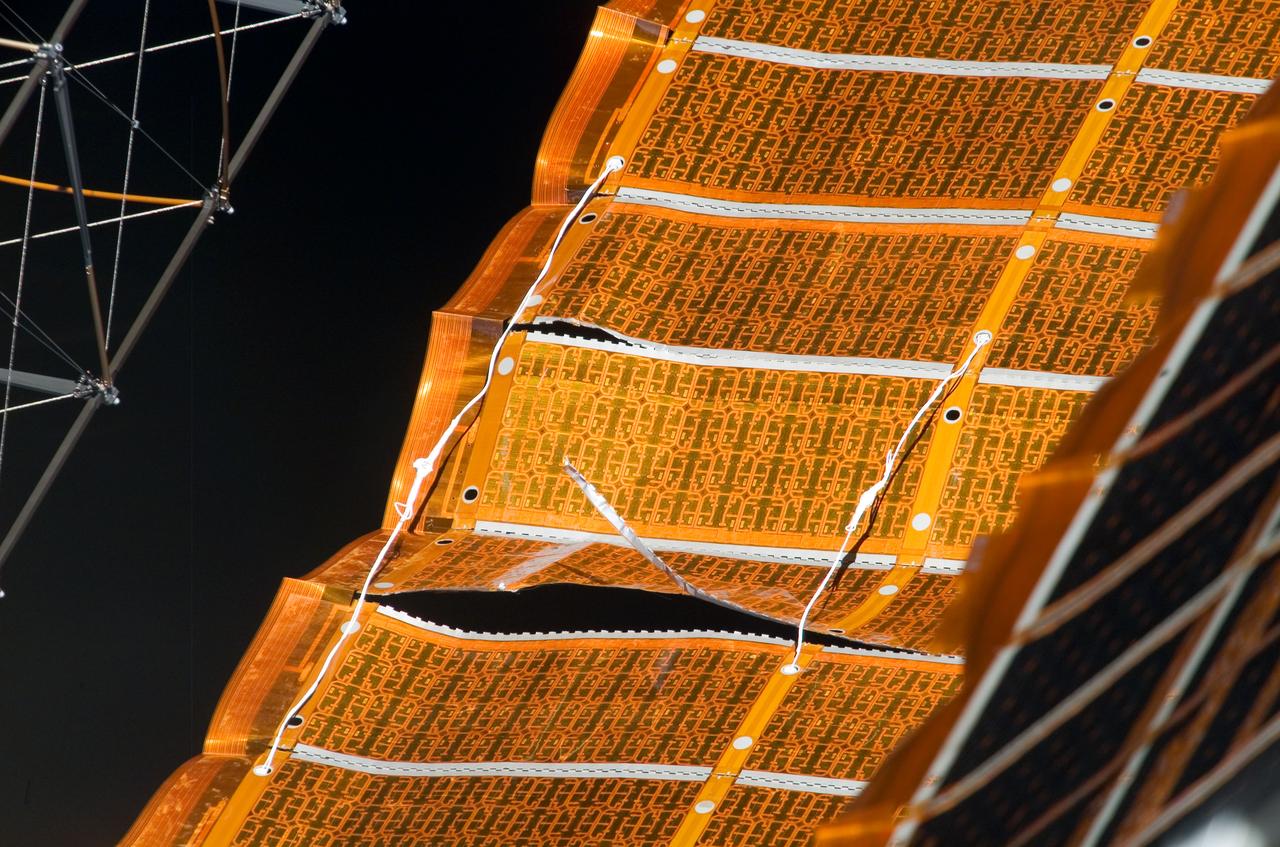 ISS016-E-008875 (3 Nov. 2007) --- View of the repaired solar array photographed during the STS-120 mission's fourth session of extravehicular activity (EVA) while Space Shuttle Discovery is docked with the International Space Station.