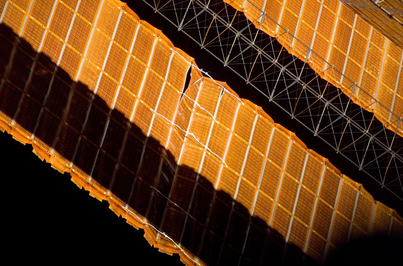 ISS016-E-009201 (3 Nov. 2007) --- View of the repaired solar array photographed during the STS-120 mission's fourth session of extravehicular activity (EVA) while Space Shuttle Discovery is docked with the International Space Station.