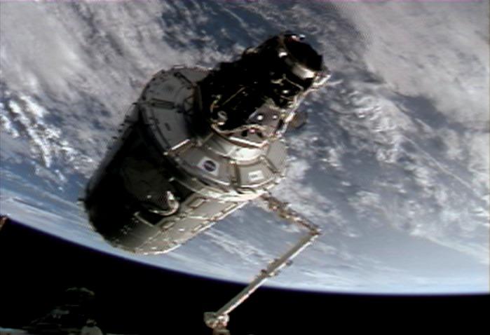 ISS016-E-011441 (14 Nov. 2007) --- In the grasp of the International Space Station's Canadarm2, the Harmony node with the Pressurized Mating Adapter (PMA-2) attached is moved from its temporary location on the left side of the Unity node to its new home on the front of the Destiny laboratory. Astronaut Daniel Tani, Expedition 16 flight engineer, operated the station's robotic arm from inside Destiny. The blackness of space and Earth's horizon provide the backdrop for the view, which was taken from NASA television.