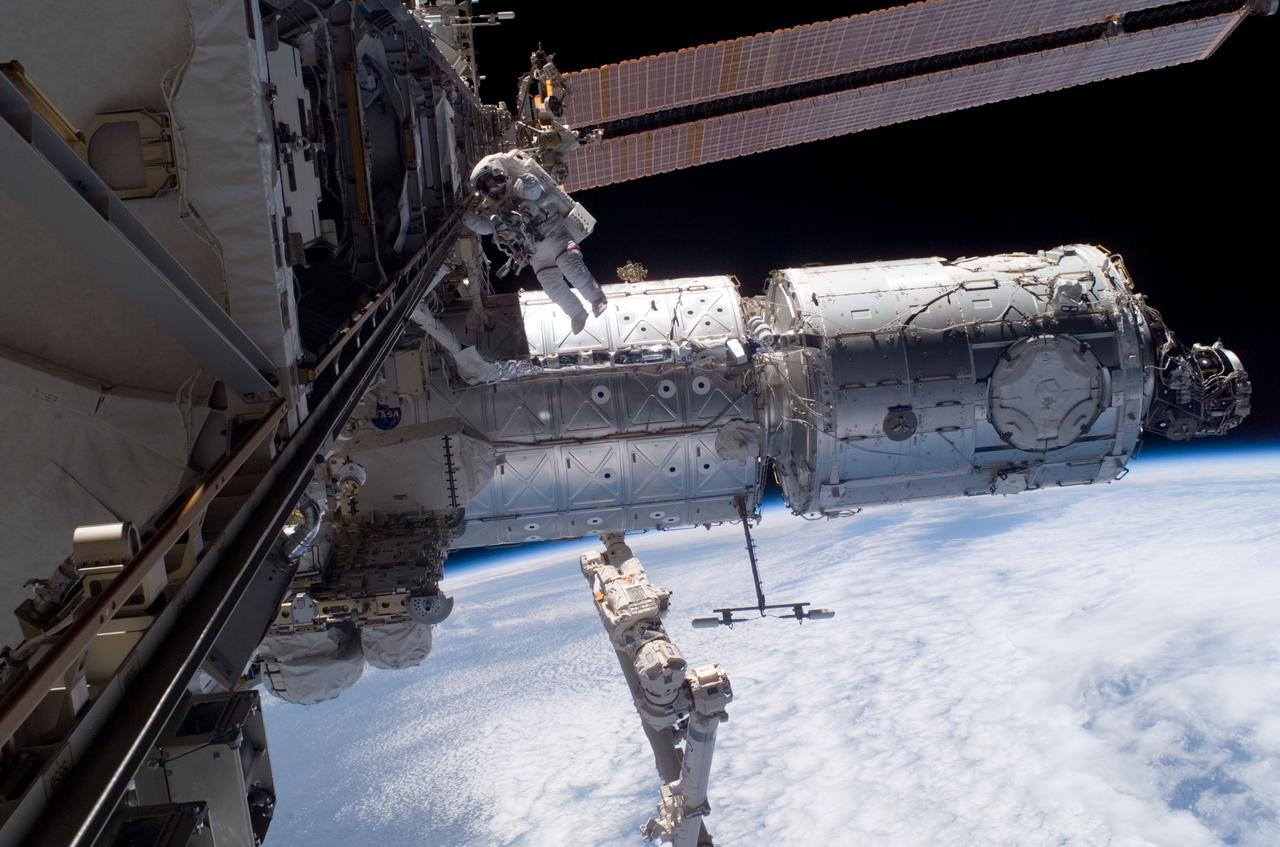 ISS016-E-012617 (24 Nov. 2007) --- Astronaut Peggy Whitson, Expedition 16 commander, participates in a session of extravehicular activity (EVA) as construction continues on the International Space Station. During the 7-hour, 4-minute spacewalk Whitson and astronaut Daniel Tani (out of frame), flight engineer, continued the external outfitting of the Harmony node in its new position in front of the Destiny laboratory. The blackness of space and Earth's horizon provide the backdrop for the scene.