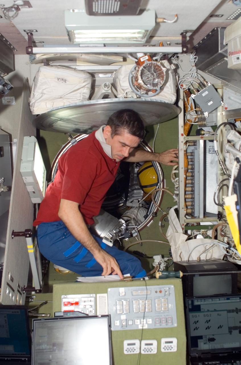 ISS016-E-019400 (30 Dec. 2007) --- Cosmonaut Yuri I. Malenchenko, Expedition 16 flight engineer representing Russia's Federal Space Agency, works in the Zvezda Service Module of the International Space Station.