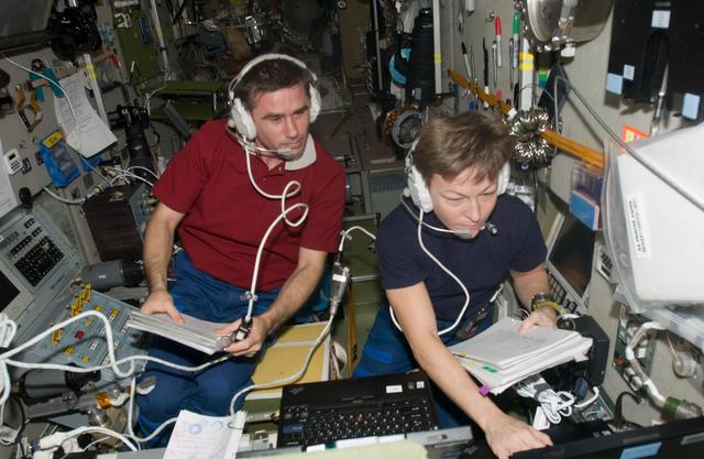 NASA image: Malenchenko and Whitson during docking procedures for Progress 27P Spacecraft