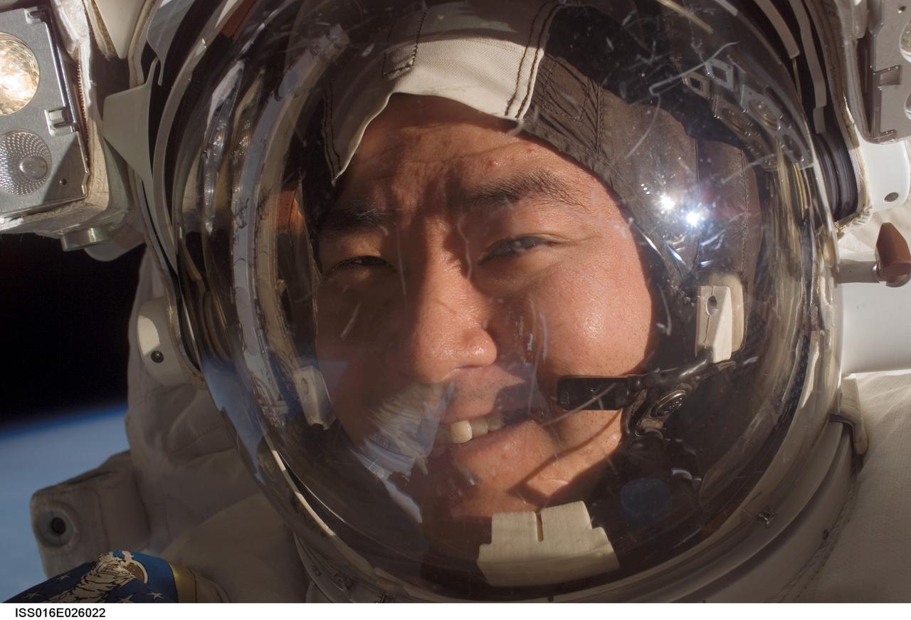 ISS016-E-026022 (30 Jan. 2008) --- The face of astronaut Daniel Tani, Expedition 16 flight engineer, is easily recognizable as he participates in a session of extravehicular activity (EVA) as maintenance and construction continue on the International Space Station. During the 7-hour, 10-minute spacewalk, Tani and astronaut Peggy Whitson (out of frame), commander, replaced a motor, known as the Bearing Motor Roll Ring Module (BMRRM), at the base of one of the station's solar wings. The BMRRM is part of the Beta Gimbal Assembly, which experienced electrical failures Dec. 8.