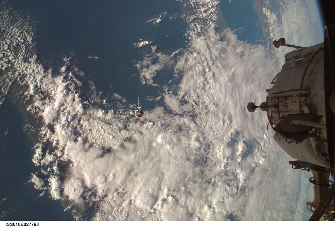 ISS016-E-027798 (7 Feb. 2008) --- Backdropped by a blue and white Earth, an unpiloted Progress supply vehicle (seen as a tiny object just left of center) approaches the International Space Station. Progress 28 resupply craft launched at 7:03 a.m. (CST) on Feb. 5, 2008 from the Baikonur Cosmodrome in Kazakhstan to deliver more than 2.5 tons of food, fuel, oxygen and other supplies to the Expedition 16 crewmembers onboard the station. Progress automatically docked to the Pirs Docking Compartment at 8:30 a.m. (CST) on Feb. 7.