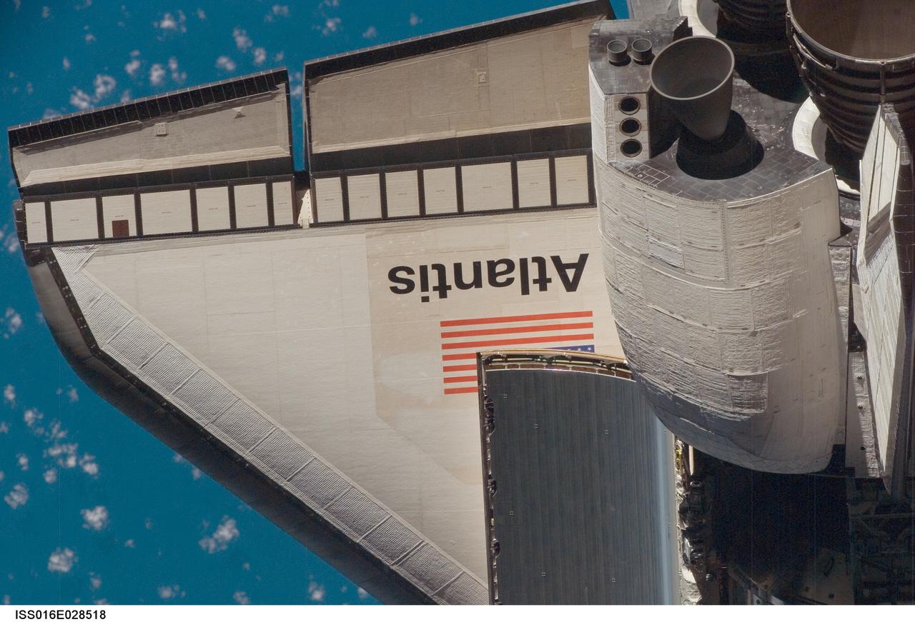 ISS016-E-028518 (9 Feb. 2008) --- An overhead view of part of the Space Shuttle Atlantis' starboard wing and part of its orbital maneuvering system pods was provided by Expedition 16 crewmembers.  Before docking with the International Space Station,  astronaut Steve Frick, STS-122 commander, flew the shuttle through a roll pitch maneuver or basically a backflip to allow the space station crew a good view of Atlantis' heat shield.  Using digital still cameras equipped with both 400  and 800 millimeter lenses, the ISS crewmembers took a number of photos of the shuttle's thermal protection system and sent them down to teams on the ground for analysis. A 400 millimeter lens was used for this image.