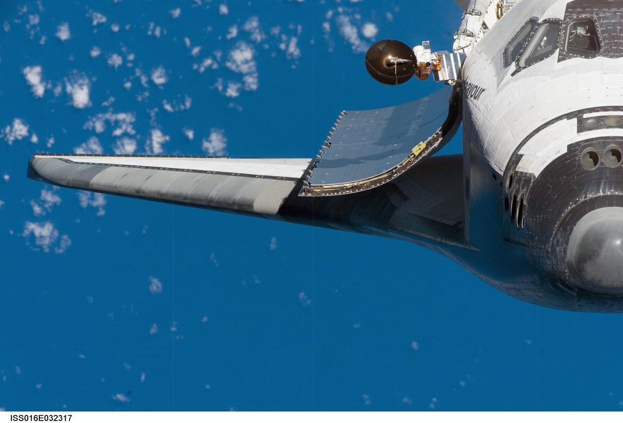 ISS016-E-032317 (12 March 2008) --- A close-up view of the exterior of Space Shuttle Endeavour's crew cabin, starboard wing and payload bay door was provided by Expedition 16 crewmembers on the International Space Station (ISS). Before docking with the station, astronaut Dominic Gorie, STS-123 commander, flew the shuttle through a roll pitch maneuver or basically a backflip to allow the space station crew a good view of Endeavour's heat shield. Using digital still cameras equipped with both 400 and 800 millimeter lenses, the ISS crewmembers took a number of photos of the shuttle's thermal protection system and sent them down to teams on the ground for analysis. A 400 millimeter lens was used for this image.