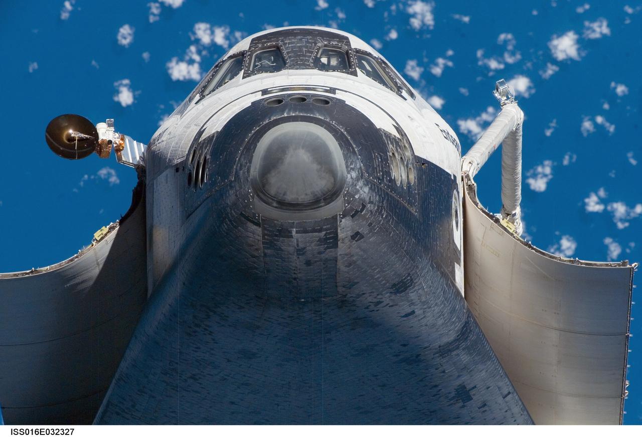 ISS016-E-032327 (12 March 2008) --- A low angle view of the nose and underside of Space Shuttle Endeavour's crew cabin was provided by Expedition 16 crewmembers on the International Space Station (ISS). Before docking with the station, astronaut Dominic Gorie, STS-123 commander, flew the shuttle through a roll pitch maneuver or basically a backflip to allow the space station crew a good view of Endeavour's heat shield. Using digital still cameras equipped with both 400 and 800 millimeter lenses, the ISS crewmembers took a number of photos of the shuttle's thermal protection system and sent them down to teams on the ground for analysis. A 400 millimeter lens was used for this image.
