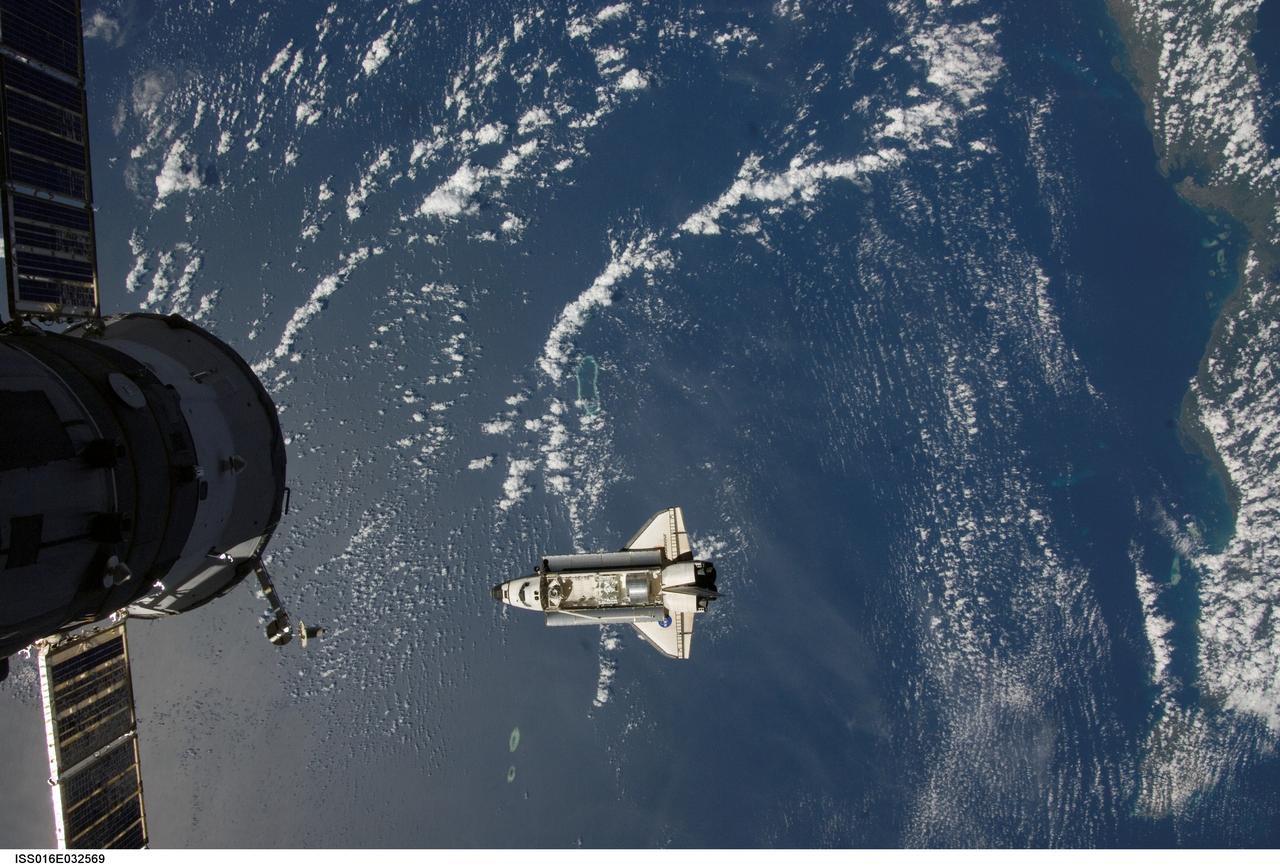 ISS016-E-032569 (12 March 2008) --- Backdropped by a blue and white Earth, Space Shuttle Endeavour approaches the International Space Station during STS-123 rendezvous and docking operations. Docking occurred at 10:49 p.m. (CDT) on March 12, 2008. The Canadian-built Dextre robotic system and the logistics module for the Japanese Kibo laboratory are visible in Endeavour's cargo bay. A Russian spacecraft, docked to the station, is visible in the foreground.