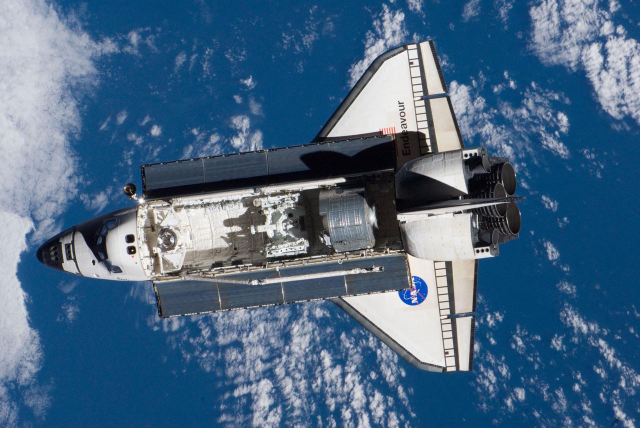 ISS016-E-032596 (12 March 2008) --- Backdropped by a blue and white Earth, Space Shuttle Endeavour approaches the International Space Station during STS-123 rendezvous and docking operations. Docking occurred at 10:49 p.m. (CDT) on March 12, 2008. The Canadian-built Dextre robotic system and the logistics module for the Japanese Kibo laboratory are visible in Endeavour's cargo bay.