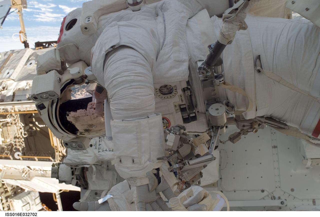 ISS016-E-032702 (13/14 March 2008) --- Astronaut Rick Linnehan, STS-123 mission specialist, participates in the mission's first scheduled session of extravehicular activity (EVA) as construction and maintenance continue on the International Space Station. During the seven-hour and one-minute spacewalk, Linnehan and astronaut Garrett Reisman (out of frame), Expedition 16 flight engineer, prepared the Japanese logistics module-pressurized section (JLP) for removal from Space Shuttle Endeavour's payload bay; opened the Centerline Berthing Camera System on top of the Harmony module; removed the Passive Common Berthing Mechanism and installed both the Orbital Replacement Unit (ORU) tool change out mechanisms on the Canadian-built Dextre robotic system, the final element of the station's Mobile Servicing System.