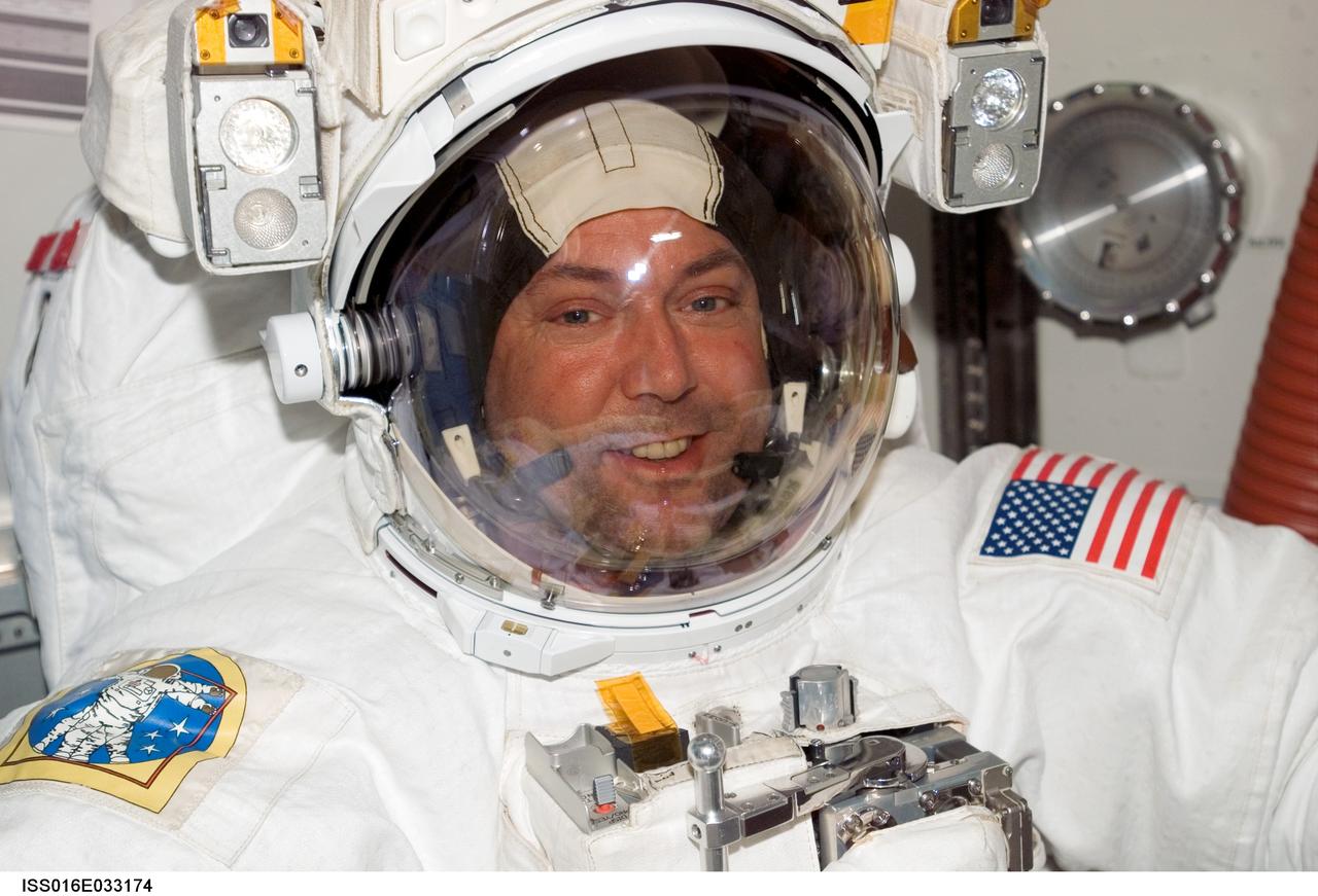 ISS016-E-033174 (20 March 2008) --- Attired in his Extravehicular Mobility Unit (EMU) spacesuit, astronaut Mike Foreman, STS-123 mission specialist, is pictured in the Quest Airlock of the International Space Station prior to the start of the mission's fourth scheduled session of extravehicular activity (EVA) while Space Shuttle Endeavour is docked with the station.