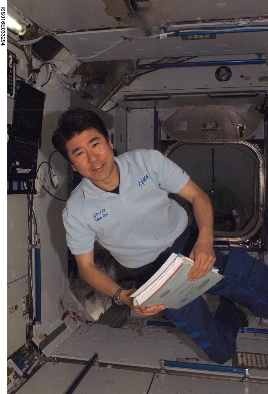 ISS016-E-033294 (22 March 2008) --- Japan Aerospace Exploration Agency (JAXA) astronaut Takao Doi, STS-123 mission specialist, floats in the Harmony node of the International Space Station while Space Shuttle Endeavour is docked with the station.