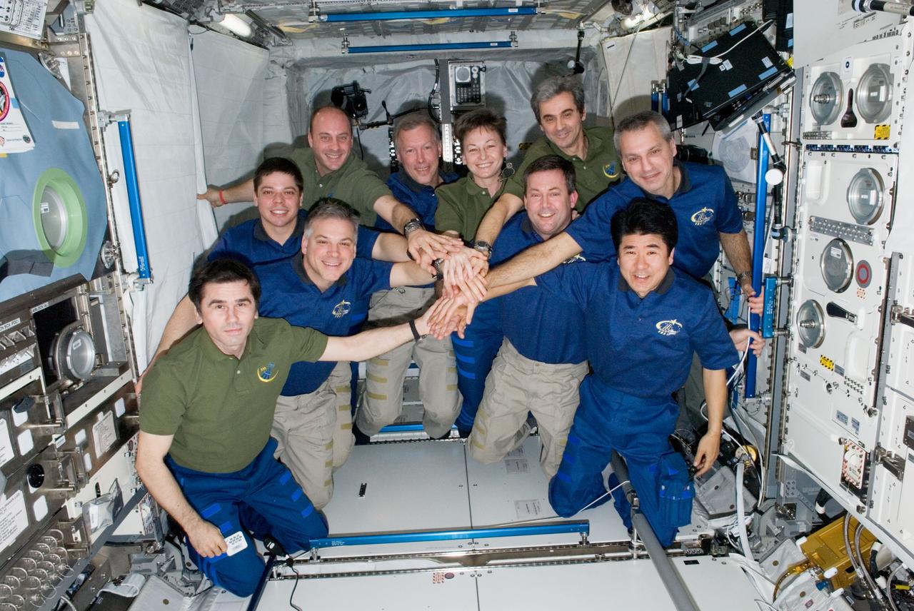 ISS016-E-033684 (24 March 2008) --- (NOTE: Picture should be rotated 180 degrees to match the identifications). The STS-123 crew used part of its last full day onboard the International Space Station posing for some in-space crew portraits. This grouping shows members of the crews for both the Space Shuttle Endeavour and Expedition 16. The Expedition 16 crew (wearing olive shirts) are astronaut Peggy Whitson (second right, rear), commander; Federal Space Agency cosmonaut Yuri Malenchenko (left, front), flight engineer; and astronaut Garrett Reisman (left rear), flight engineer. Also in a green shirt is European Space Agency astronaut Leopold Eyharts (right rear), former Expedition 16 flight engineer, who has moved over to the STS-123 crew. Soon to be leaving the station at this juncture along with Eyharts are the blue-clad Endeavour crew of astronauts Dominic Gorie (second left, rear), commander; Gregory H. Johnson (behind Malenchenko), pilot; and JAXA astronaut Takao Doi (right front), Rick Linnehan (behind Doi); Mike Foreman (second right, center row); Robert L. Behnken (far left, center row) all mission specialists.