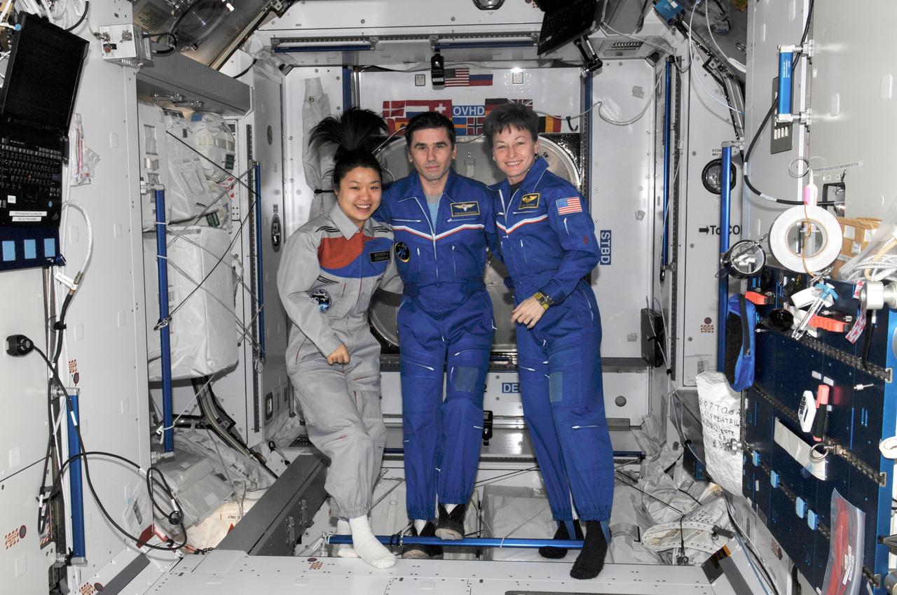 ISS016-E-036365 (17 April 2008) --- NASA astronaut Peggy Whitson (right), Expedition 16 commander; Russian Federal Space Agency cosmonaut Yuri Malenchenko, flight engineer; and South Korean spaceflight participant So-yeon Yi pose for a photo in the Harmony node of the International Space Station.