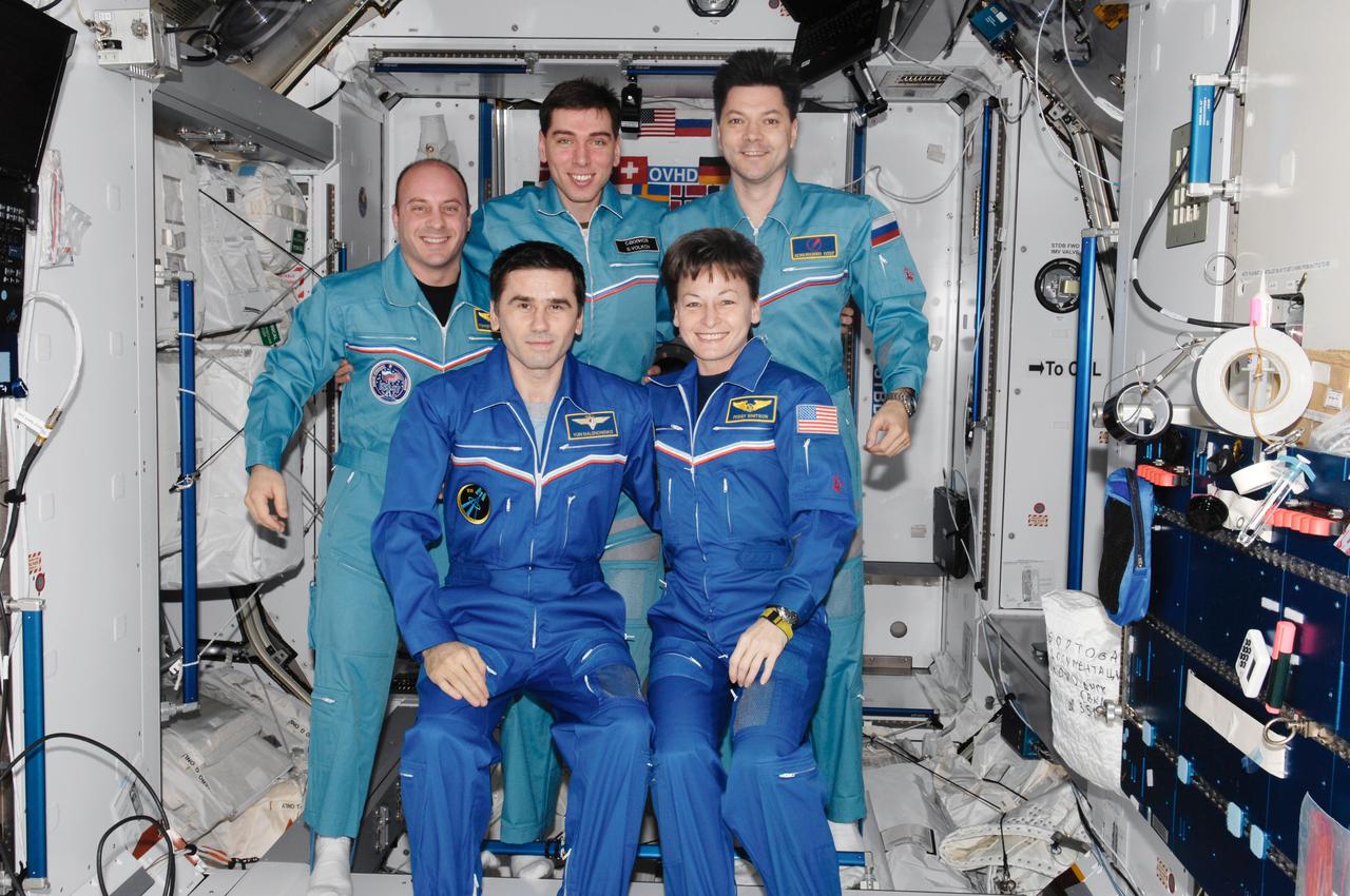 ISS016-E-036367 (17 April 2008) --- The crewmembers onboard the International Space Station pose for a group portrait during the ceremony of Changing-of-Command from Expedition 16 to Expedition 17 in the Harmony node. From the right (front row) are NASA astronaut Peggy Whitson, Expedition 16 commander; and Russian Federal Space Agency cosmonaut Yuri Malenchenko, Expedition 16 flight engineer. From the right (back row) are Russian Federal Space Agency cosmonauts Oleg Kononenko, Expedition 17 flight engineer; Sergei Volkov, Expedition 17 commander; and NASA astronaut Garrett Reisman, flight engineer.