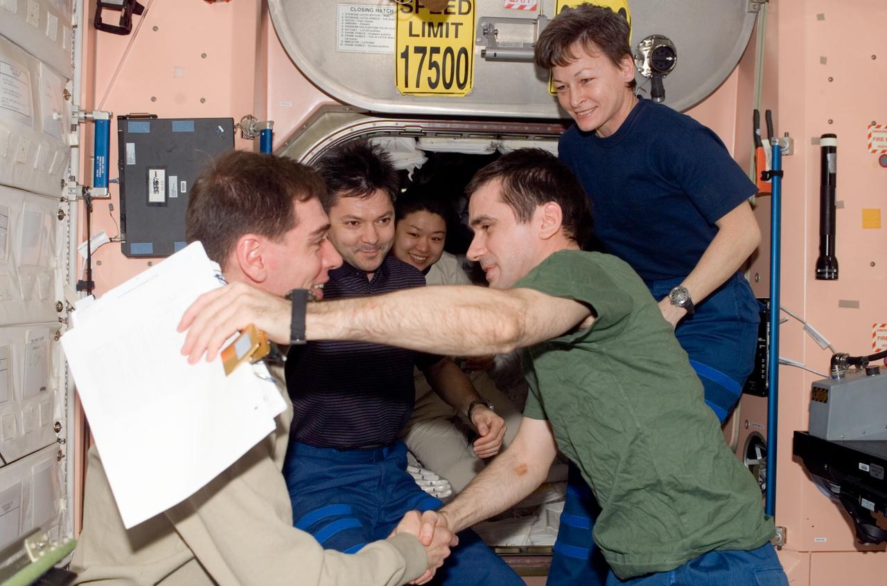 ISS016-E-036441 (19 April 2008) --- The Expedition 16 crewmembers and spaceflight participant bid farewell to Expedition 17 crewmembers prior to boarding their Soyuz spacecraft for their trip back to Earth. Pictured on the right are Russian Federal Space Agency cosmonaut Yuri Malenchenko, Expedition 16 flight engineer, and NASA astronaut Peggy Whitson, Expedition 16 commander. Visible in the background is South Korean spaceflight participant So-yeon Yi. Russian Federal Space Agency cosmonauts Sergei Volkov (foreground) and Oleg Kononenko, Expedition 17 commander and flight engineer, respectively, are pictured at left.