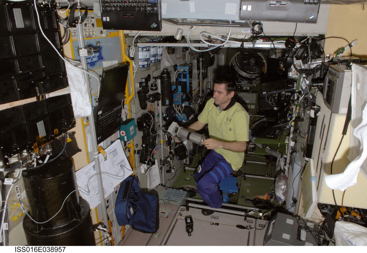 iss016e038957 (3/12/2008) --- Cosmonaut Yuri Malenchenko holds the combined signal generation unit with the connected calibrator for the Dykhanie (Respiration) experiment. The Study of the Regulation and Biomechanics of Respiration in Spaceflight (Dykhanie) investigates upper respiratory functions in long-term orbital flight on the International Space Station (ISS) in order to improve the medical monitoring and countermeasures system for future long-duration crew members.