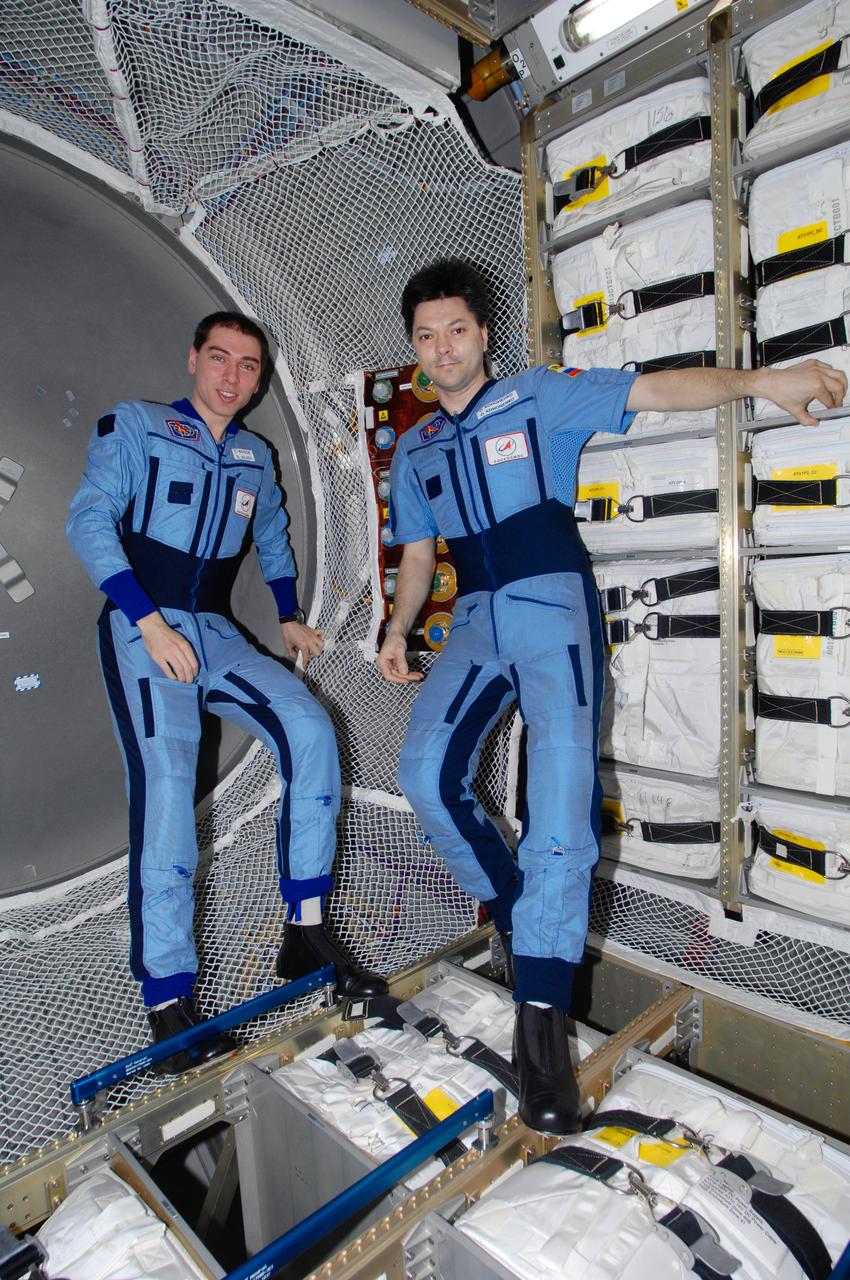 ISS017-E-006544 (12 May 2008) --- Russian Federal Space Agency cosmonauts Sergei Volkov (left), Expedition 17 commander, and Oleg Kononenko, flight engineer, take a moment for a photo in the Jules Verne Automated Transfer Vehicle (ATV) while it remains docked with the International Space Station.