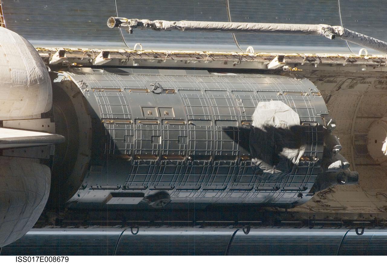 ISS017-E-008679 (2 June 2008) --- An overhead view of the second component of the Japan Aerospace Exploration Agency's Kibo laboratory, the Japanese Pressurized Module (JPM) in Space Shuttle Discovery's cargo bay was provided by Expedition 17 crewmembers. Before docking with the station, astronaut Mark Kelly, STS-124 commander, flew the shuttle through a roll pitch maneuver or basically a backflip to allow the space station crew a good view of Discovery's heat shield. Using digital still cameras equipped with both 400 and 800 millimeter lenses, the ISS crewmembers took a number of photos of the shuttle's thermal protection system and sent them down to teams on the ground for analysis. A 400 millimeter lens was used for this image.