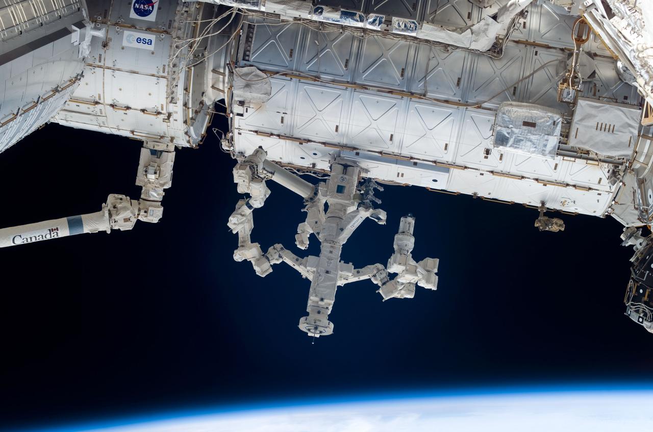 ISS017-E-009056 (5 June 2008) --- Located on the exterior of the Destiny laboratory of the International Space Station, the Canadian-built Dextre, also known as the Special Purpose Dextrous Manipulator, is photographed by a crewmember during the STS-124 mission's second planned spacewalk. The blackness of space and Earth's horizon provide the backdrop for the scene.
