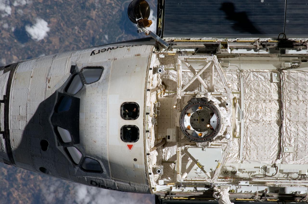 ISS017-E-009386 (11 June 2008) --- A nadir view of the Space Shuttle Discovery's crew cabin and the forward section of the payload bay soon after the shuttle and the International Space Station began their post-undocking relative separation on June 11. One of the Expedition 17 crewmembers recorded the photo with a digital still camera.
