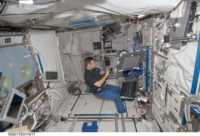 NASA image: Chamitoff works with 3-D Space Experiment Hardware in the European Laboratory during Expedition 17