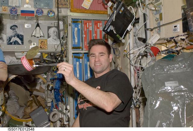 NASA image: Chamitoff prepares to eat a meal in the SM during Expedition 17