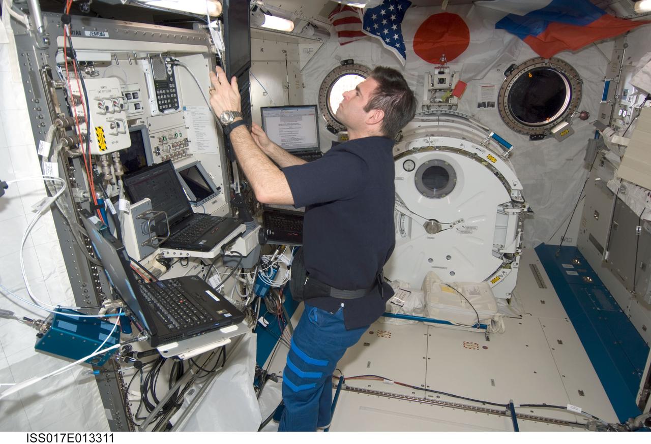 ISS017-E-013311 (15 Aug. 2008) --- NASA astronaut Greg Chamitoff, Expedition 17 flight engineer, uses a computer near the Japanese Remote Manipulator System (JEM-RMS) work station in the Kibo laboratory of the International Space Station.