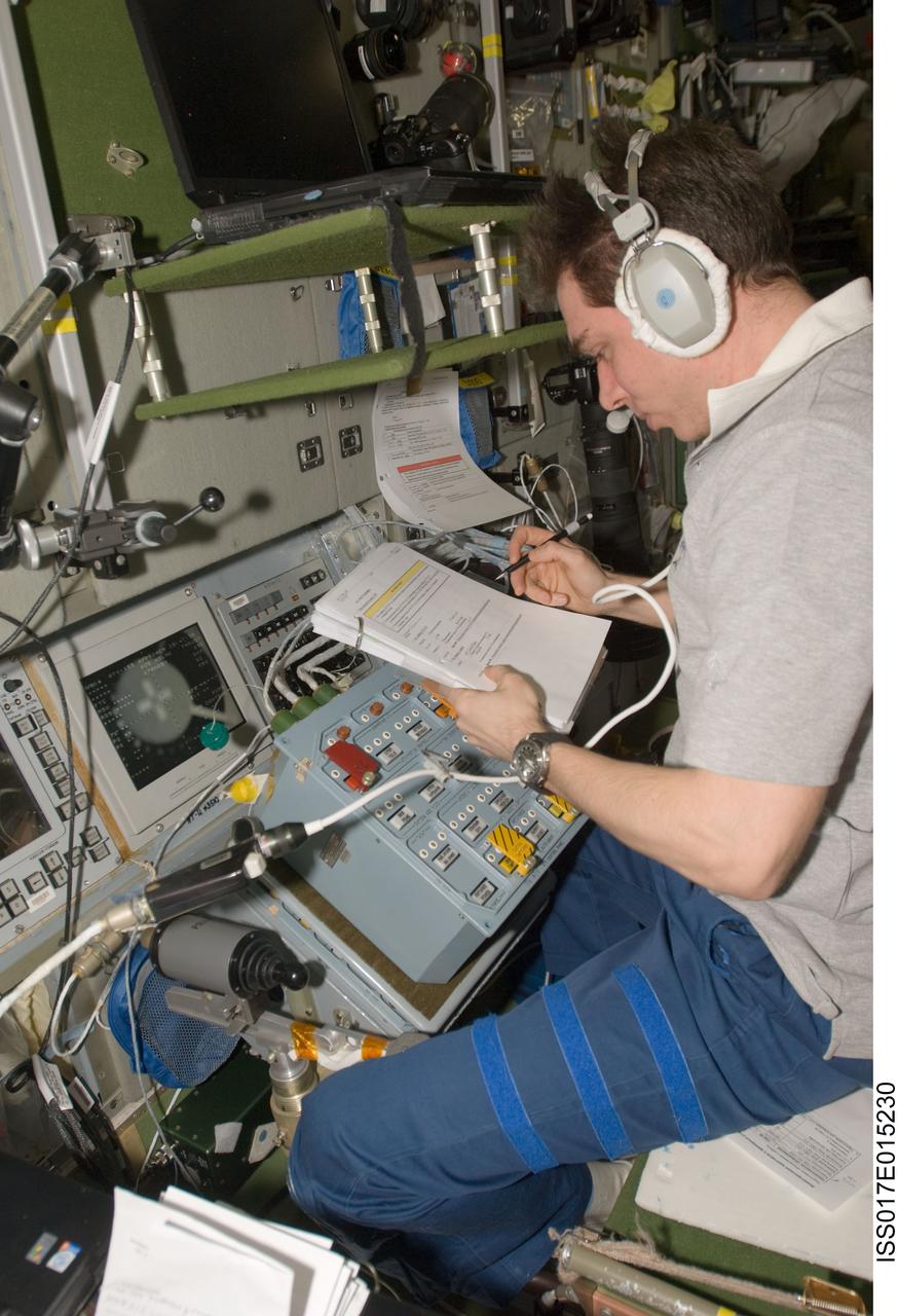 ISS017-E-015230 (5 Sept. 2008) --- Russian Federal Space Agency cosmonaut Sergei Volkov, Expedition 17 commander, makes preparations in the International Space Station's Zvezda Service Module for the undocking of the European Space Agency's (ESA) "Jules Verne" Automated Transfer Vehicle (ATV). The ATV departed from the aft port of Zvezda at 4:29 p.m. (CDT) on Sept. 5, 2008 and was placed in a parking orbit for three weeks, scheduled to be deorbited on Sept. 29 when lighting conditions are correct for an ESA imagery experiment of reentry.