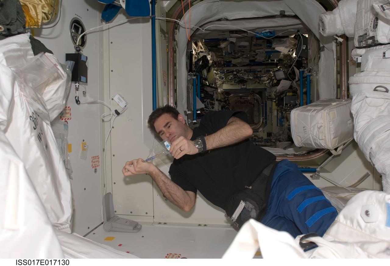 Chamitoff works in the Node 1 during Expedition 17