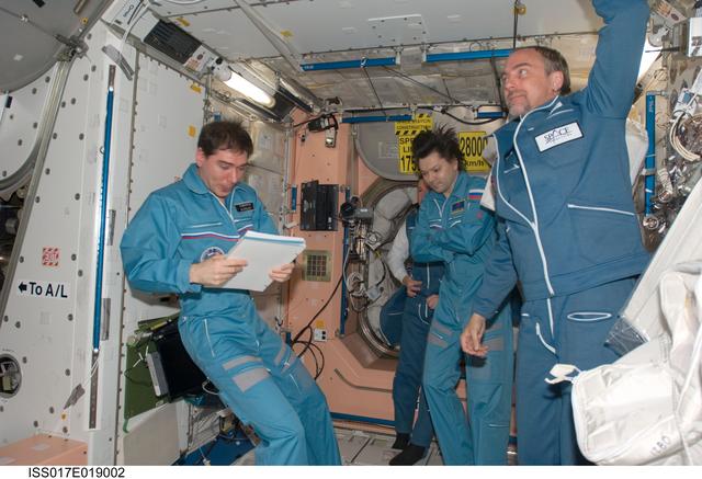 NASA image: Volkov, Garriott, Kononenko, and Lonchakov in the Node 1 during Joint Operations