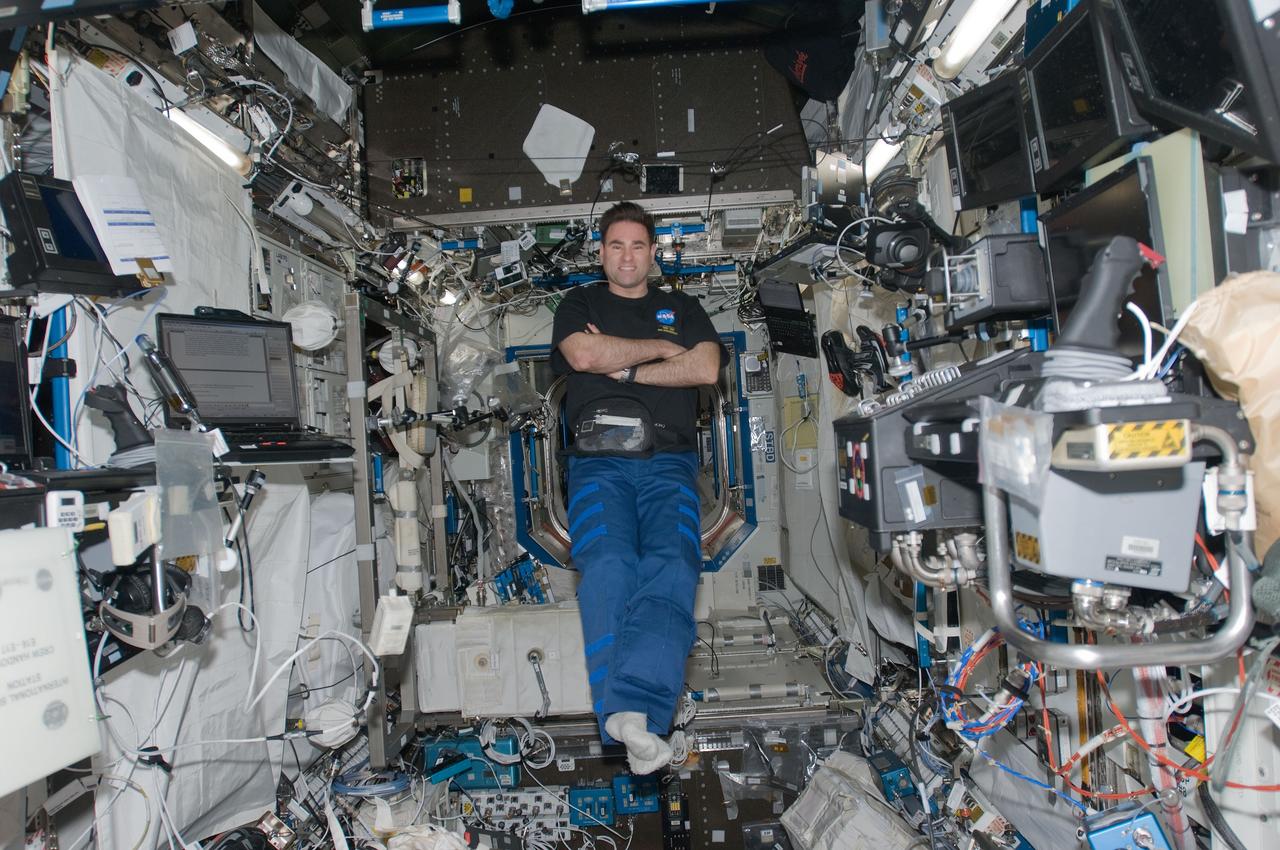 ISS017-E-019013 (13 Oct. 2008) --- NASA astronaut Greg Chamitoff, Expedition 17 flight engineer, poses for a photo while floating in the Destiny laboratory of the International Space Station.