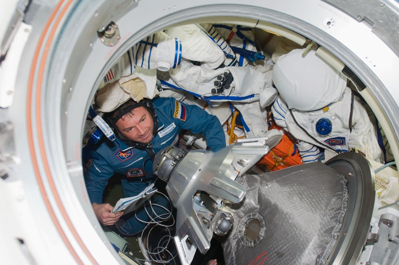 ISS017-E-019022 (14 Oct. 2008) --- Russian Federal Space Agency cosmonaut Yury Lonchakov, Expedition 18 flight engineer, ingresses the Earth-facing port of the International Space Station's Zarya module after arriving onboard the Soyuz TMA-13 spacecraft with NASA astronaut Michael Fincke, commander, and American spaceflight participant Richard Garriott (both out of frame). Hatches between the two spacecraft were opened at 4:55 a.m. (CDT).
